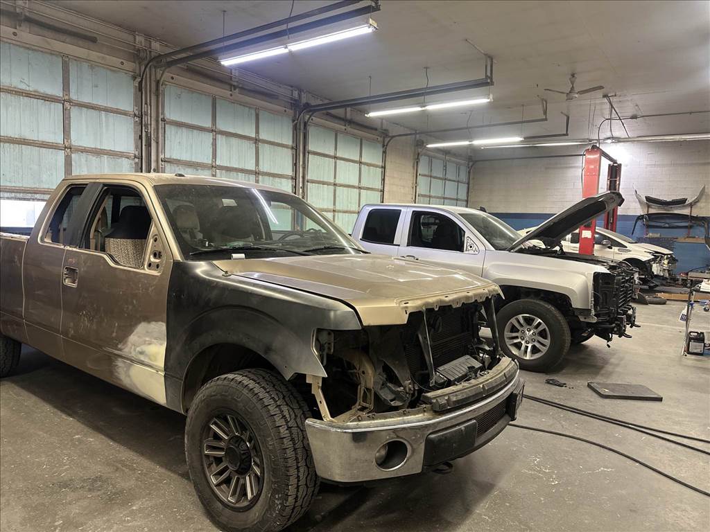 Damaged vehicles being repaired